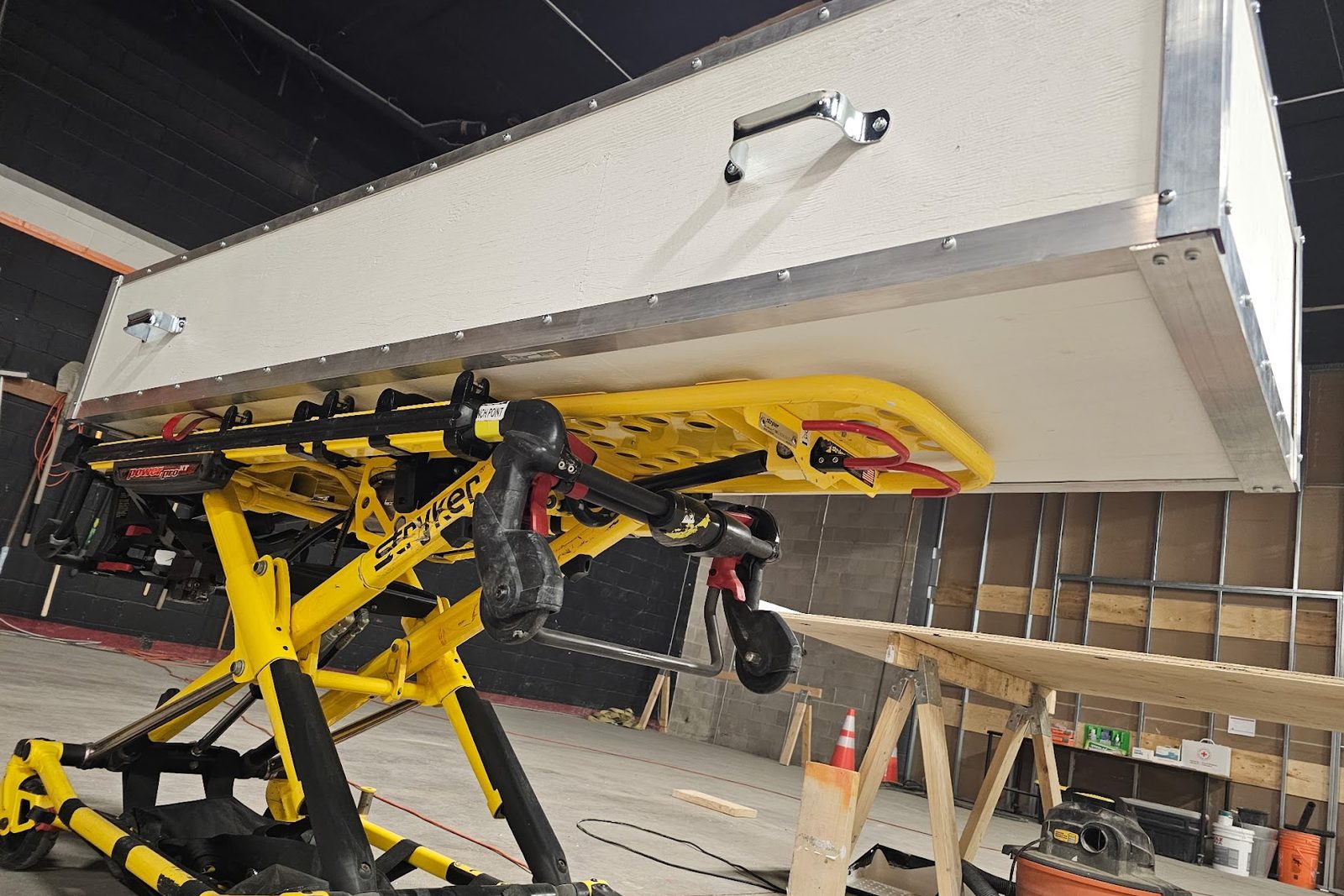 The ice bath raised above a Stryker stretcher in the operations facility
