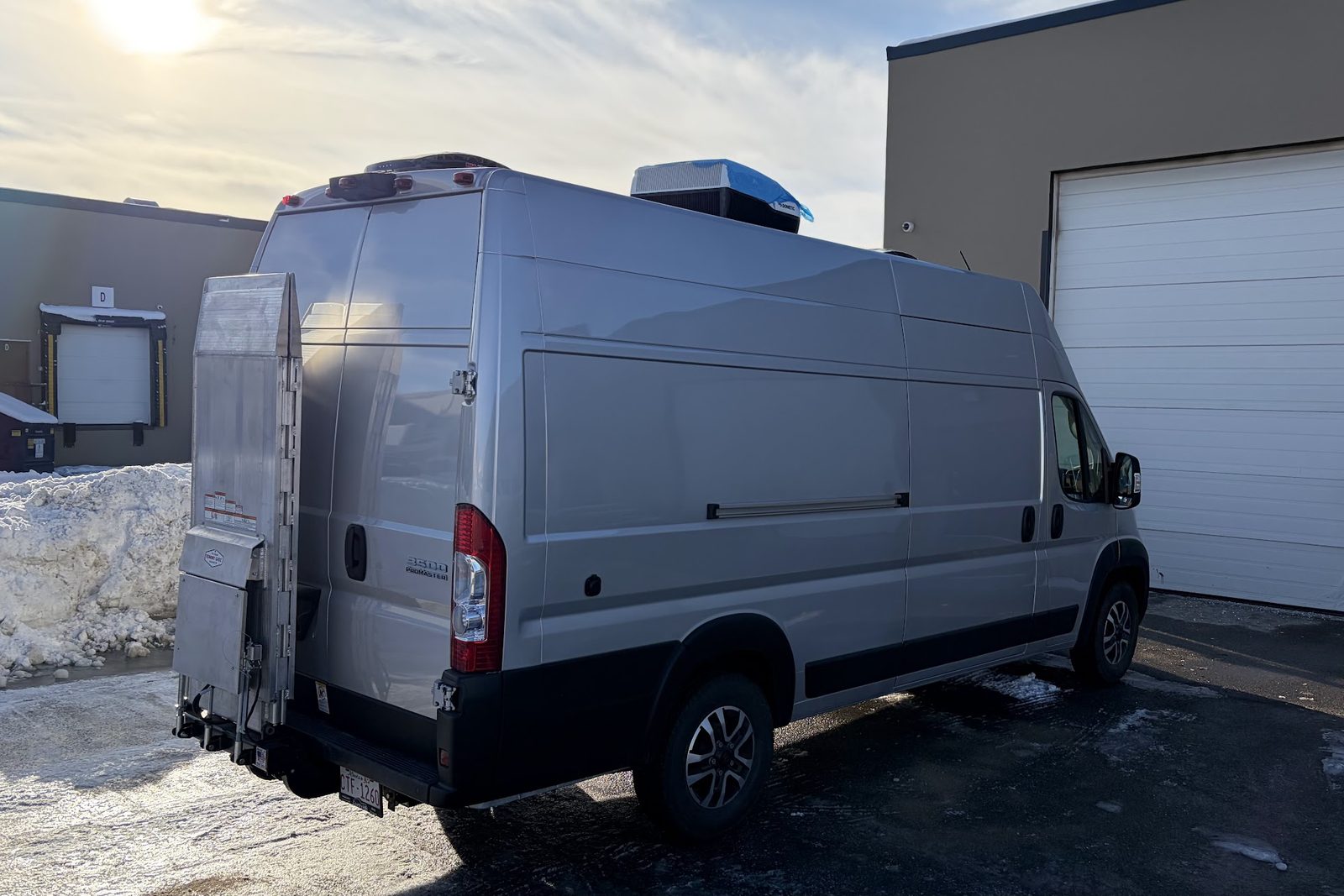 The response van with its lift gate, parked outside the operations facility in winter